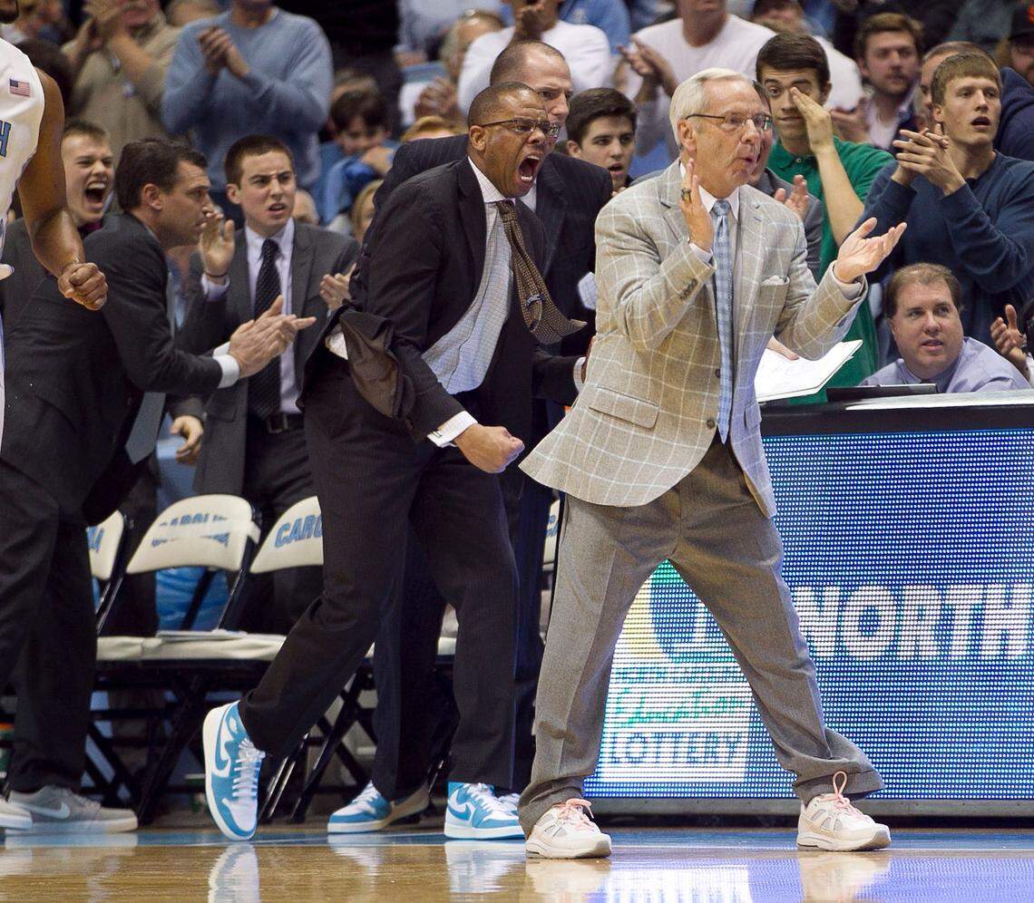 UNC coach Roy Williams and assistant coach Hubert Davis show their support for James Michael McAdoo (43) after he made a steal and scored on a fast break in the first half against Clemson on Sunday January 26, 2014 at the Smith Center in Chapel Hill, N.C.