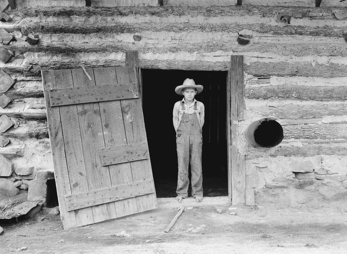 Farm Security Administration photographer Dorothea Lange photographed a boy at the his family’s log tobacco barn in Person County in 1939.  Part of the mission of the FSA was to document poverty in rural parts of the country.