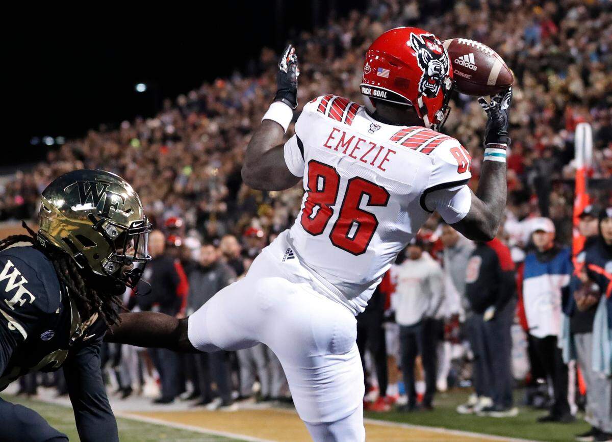 N.C. State wide receiver Emeka Emezie (86) makes a one-handed grab for a two-point conversion as Wake Forest defensive back Ja’Sir Taylor (6) defends during the second half of Wake Forest’s 45-42 victory over N.C. State at Truist Field in Winston-Salem, N.C., Saturday, November 13, 2021.