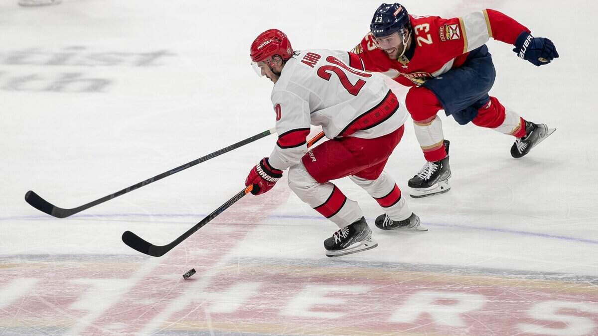 The Florida Panthers Carter Verhaeghe (23) works to defend the Carolina Hurricanes Sebastian Aho (20) in the second period of Game 4 of the Eastern Conference Finals on Wednesday, May 24, 2023 at FLA Live Arena in Sunrise, Fla.