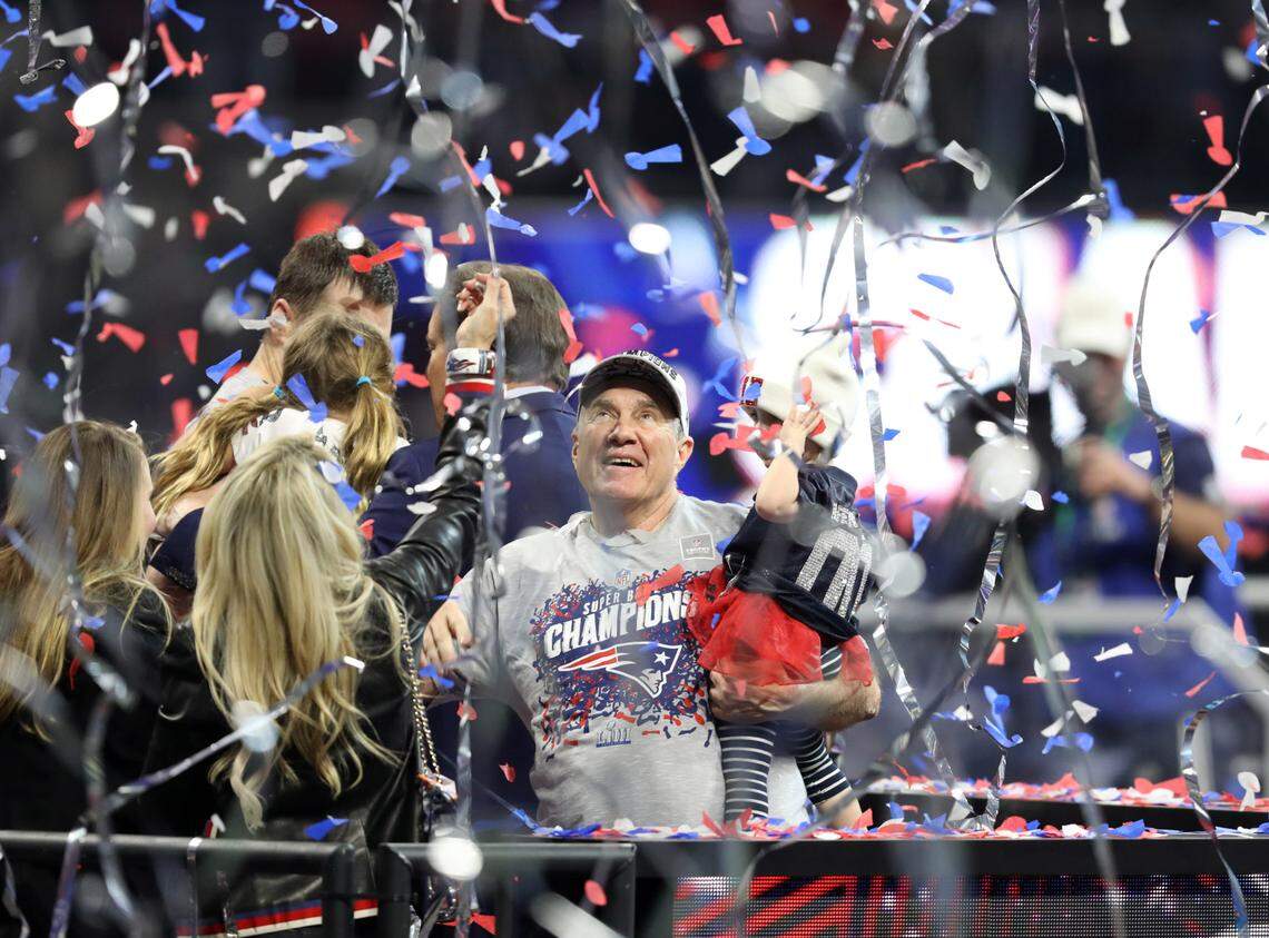 New England Patriots head coach Bill Belichick holds his granddaughter Blakely after winning Super Bowl LIII against the Los Angeles Rams at Mercedes-Benz Stadium in 2019.