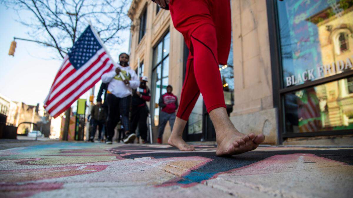 A group of veterans organized by Walk for Vets, an organization campaigning to bring awareness to veterans suicides, march Monday, Feb 14, 2022 in downtown Raleigh. The group walked 2.2 miles through downtown Raleigh to raise awareness of the roughly 22 veterans who die by suicide each day.
