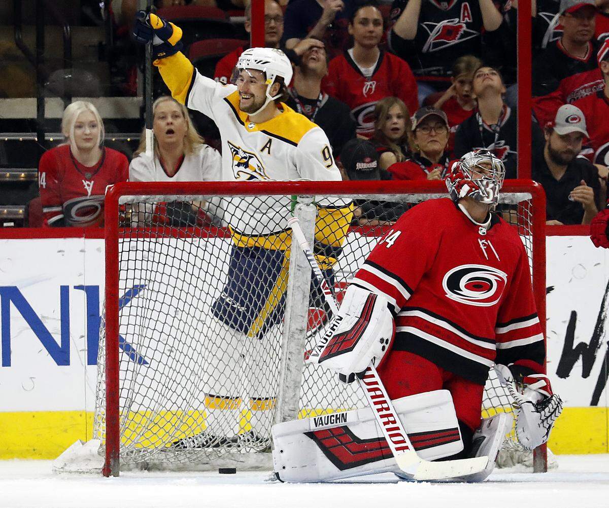 Nashville Predators’ Filip Forsberg (9) celebrates the game winning overtime goal by teammate Ryan Johansen, not pictured, behind Carolina Hurricanes goaltender Petr Mrazek (34) at an NHL preseason hockey game, Sunday, Sept. 30, 2018, in Raleigh, N.C. 