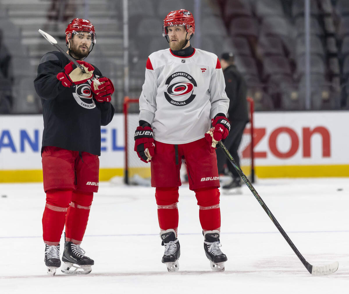 Carolina Hurricanes defenseman Sean Walker (26) talks with left wing Nikolaj Ehlers (27) during practice on Monday, June 8, 2026 at T-Mobile Arena in Las Vegas, NV.