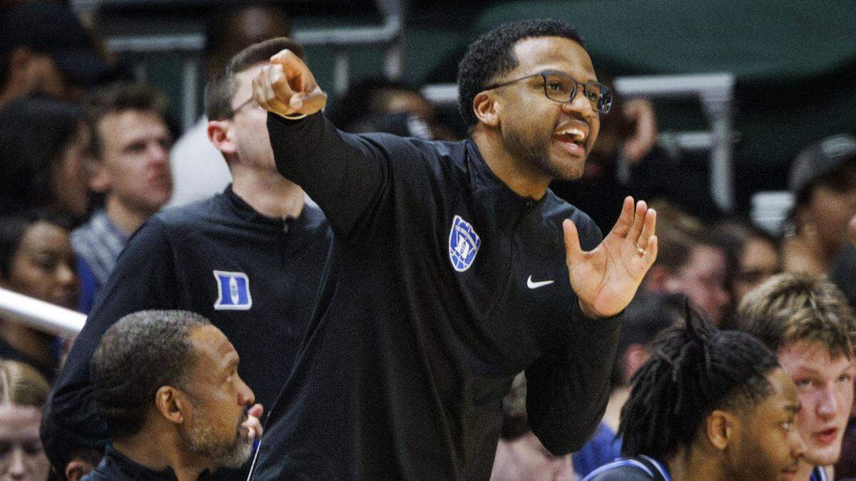 Jai Lucas, current Duke University Assistant Basketball Coach, yells to his current his players during the second half of a game against the Miami (Fl) Hurricanes on Tuesday, Feb. 25, 2025, at Watsco Center in Coral Gables, Fla. The Blue Devils won 97-60.