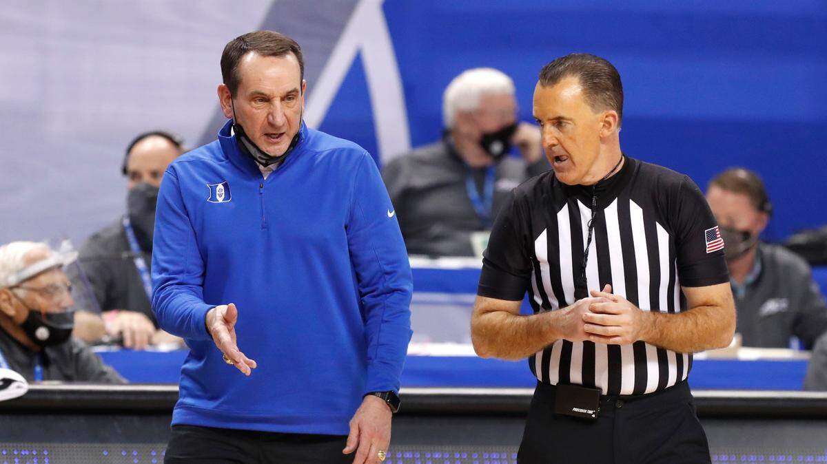 Duke coach Mike Krzyzewski argues a call with official Roger Ayers during Duke’s game against Louisville during the ACC tournament. Ayers was one of six officials sent home from the NCAA tournament Monday after one of them tested positive for COVID-19.