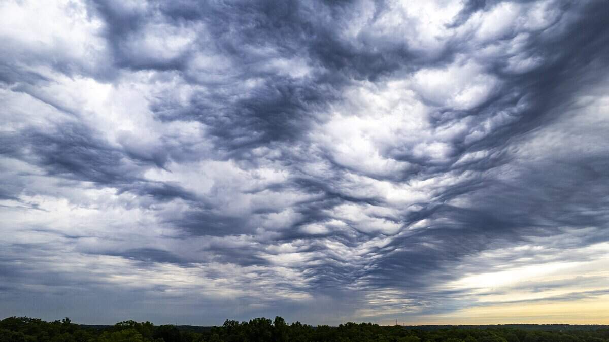 Dramatic clouds gather over Raleigh as light rain falls in parts of the city Tuesday morning, April 28, 2026. All 100 North Carolina counties are in moderate to extreme drought conditions, according to the North Carolina Drought Management Advisory Council.