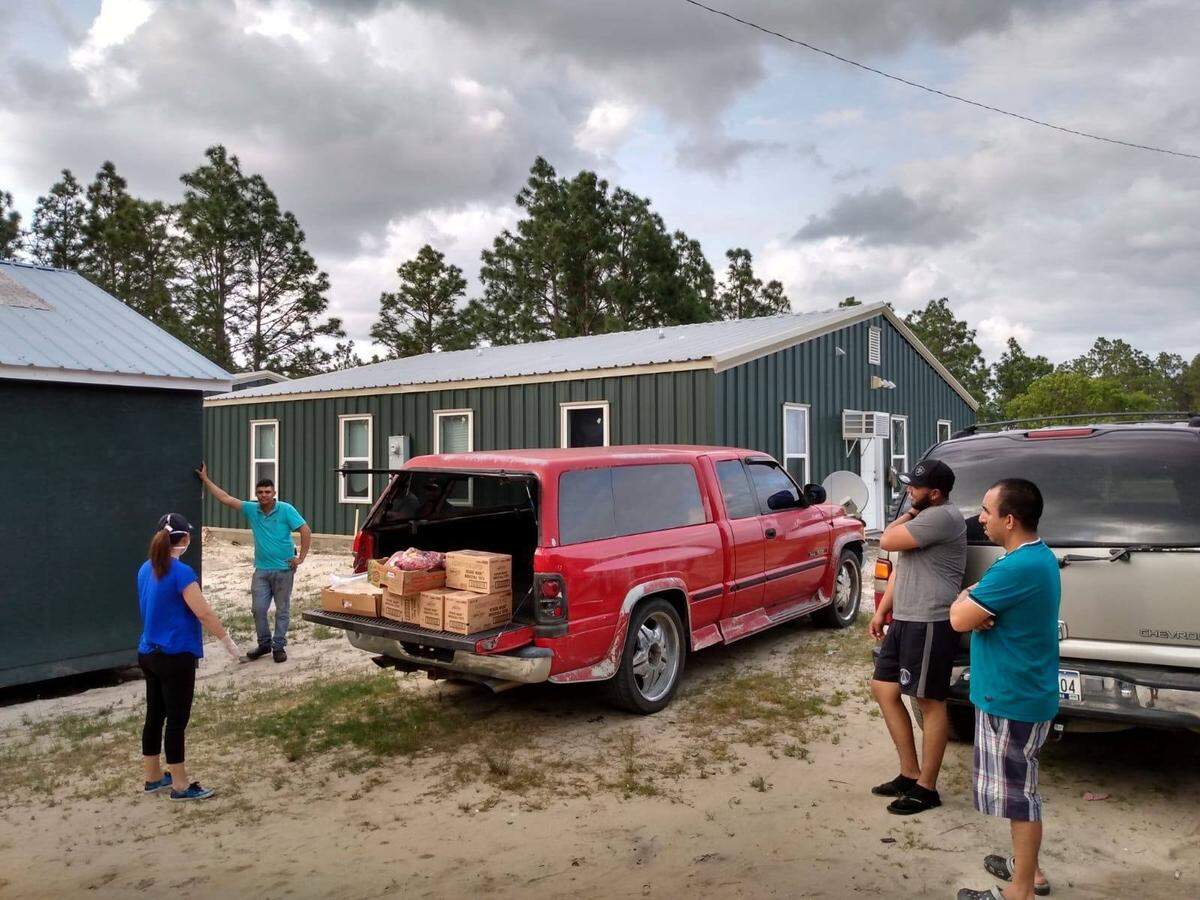 The Episcopal Farmworker Ministry, based in Harnett County, serving seasonal farmworkers at Sleepy Creek Farms in Bladen County with needed groceries in April 18. A coronavirus outbreak had not yet been reported at the farm.