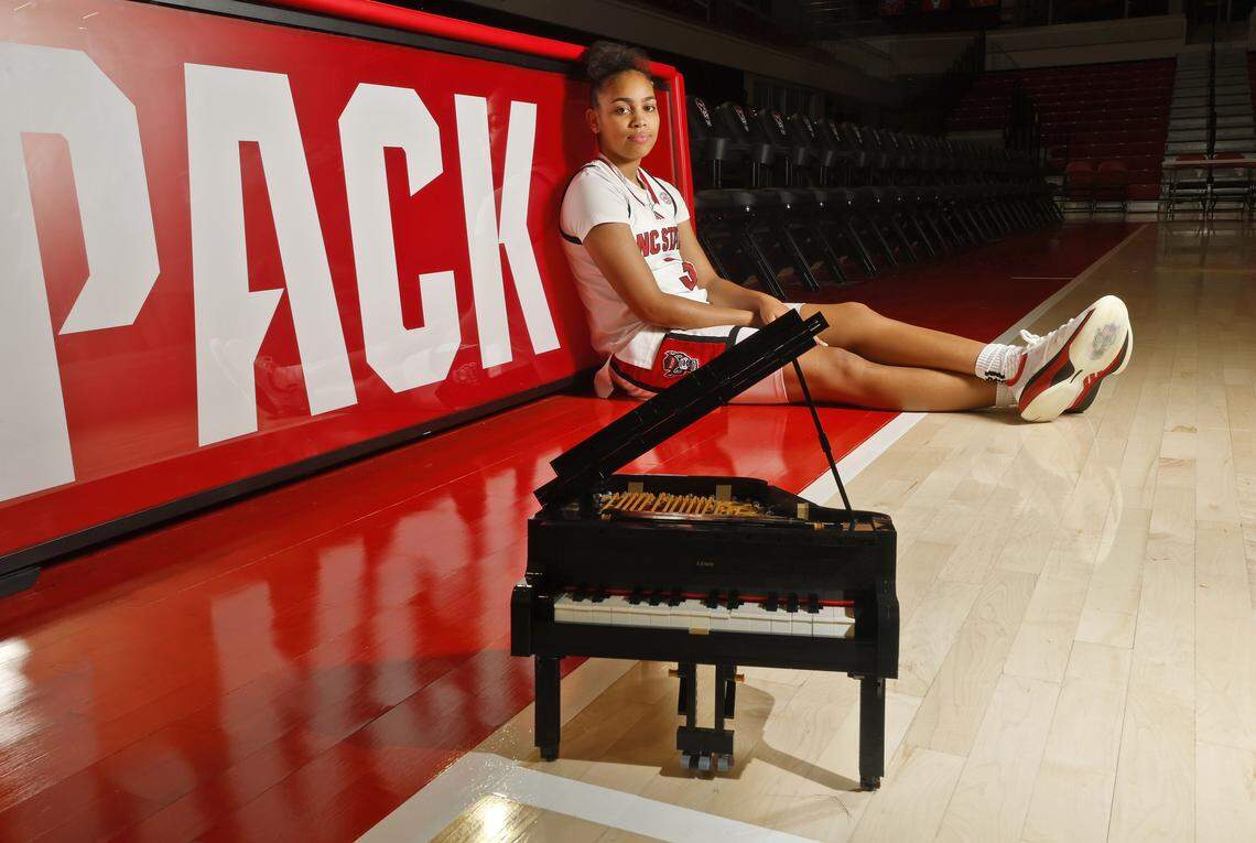 N.C. State sophomore guard Zamareya Jones, photographed on Saturday, Jan. 3, 2026, at Reynolds Coliseum, poses for a portrait with a Grand Piano Lego set she constructed.