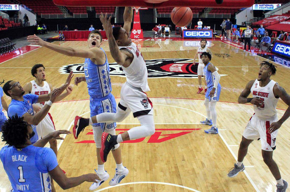 N.C. State’s Shakeel Moore (2) slams in two in the second half during N.C. State’s 79-76 victory over UNC at PNC Arena in Raleigh, N.C., Tuesday, December 22, 2020.