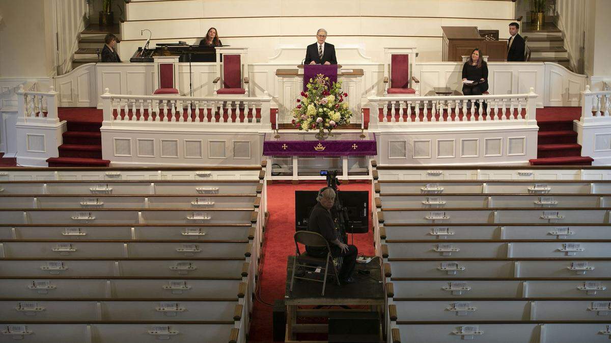 Dr. David Hailey delivers his weekly sermon to an empty sanctuary at Hayes Barton Baptist Church on Sunday, March 22, 2020, in Raleigh, N.C. This is the second week the sanctuary has been closed to the public due to the spread of the COVID-19 virus.