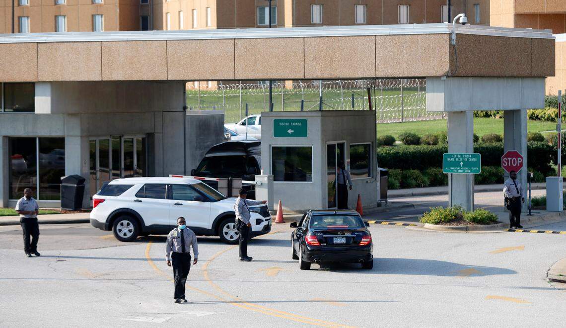 Officers stand outside the entrance to Central Prison in Raleigh, N.C., Friday, July 10, 2020.