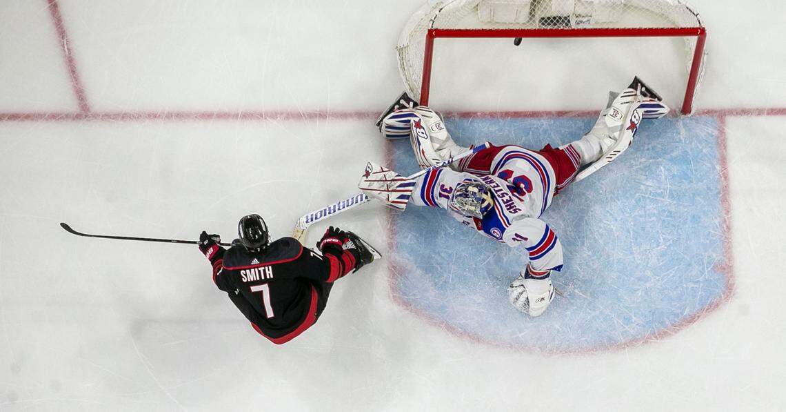 Carolina Hurricanes Brendan Smith (7) scores on New York Rangers goalie Igor Shesterkin (31) to give the Hurricanes a 1-0 lead in the second period on Friday, May 20, 2022 during game two of the Stanley Cup second round at PNC Arena in Raleigh, N.C.