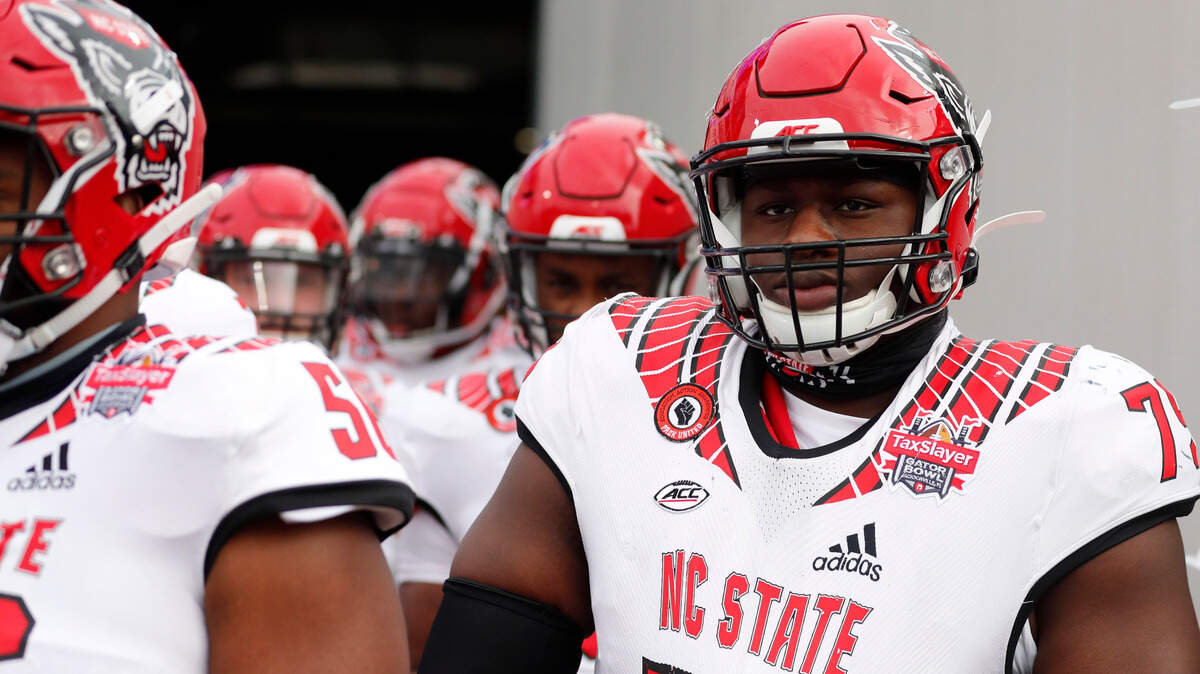 N.C. State’s Ikem Ekwonu waits to take the field before the start of N.C. StateÕs game against Kentucky in the Gator Bowl at TIAA Bank Field in Jacksonville, Fla., Saturday, January 2, 2021.