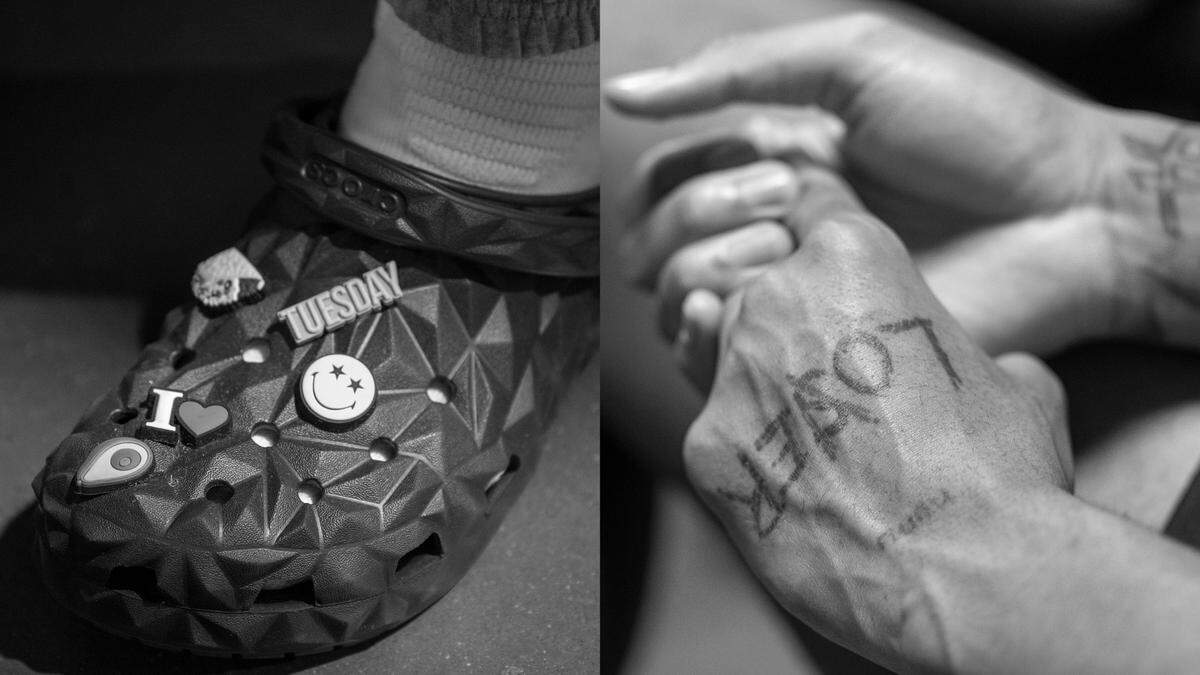 North Carolina’s R.J. Davis sports crocks with his own personal embellishments. Armando Bacot’s tattooed hands, during the Tar Heels media availability on Friday, March 22, 2024 at Spectrum Center in Charlotte, N.C.