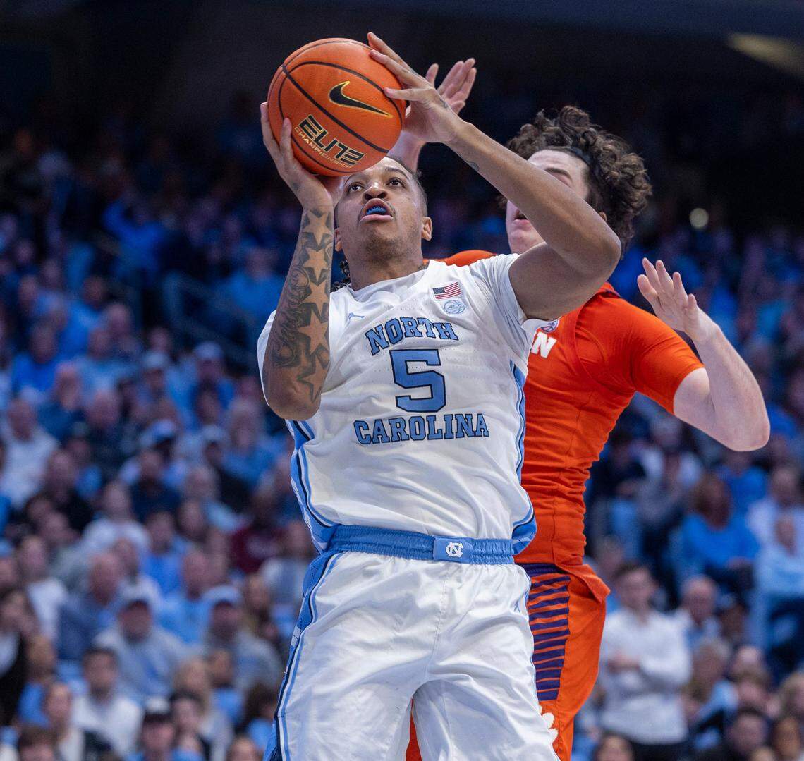 North Carolina’s Armando Bacot (5) puts up a shot against Clemson’s P.J. Hall (24) in the second half on Tuesday, February 6, 2024 at the Dean E. Smith Center in Chapel Hill, N.C.
