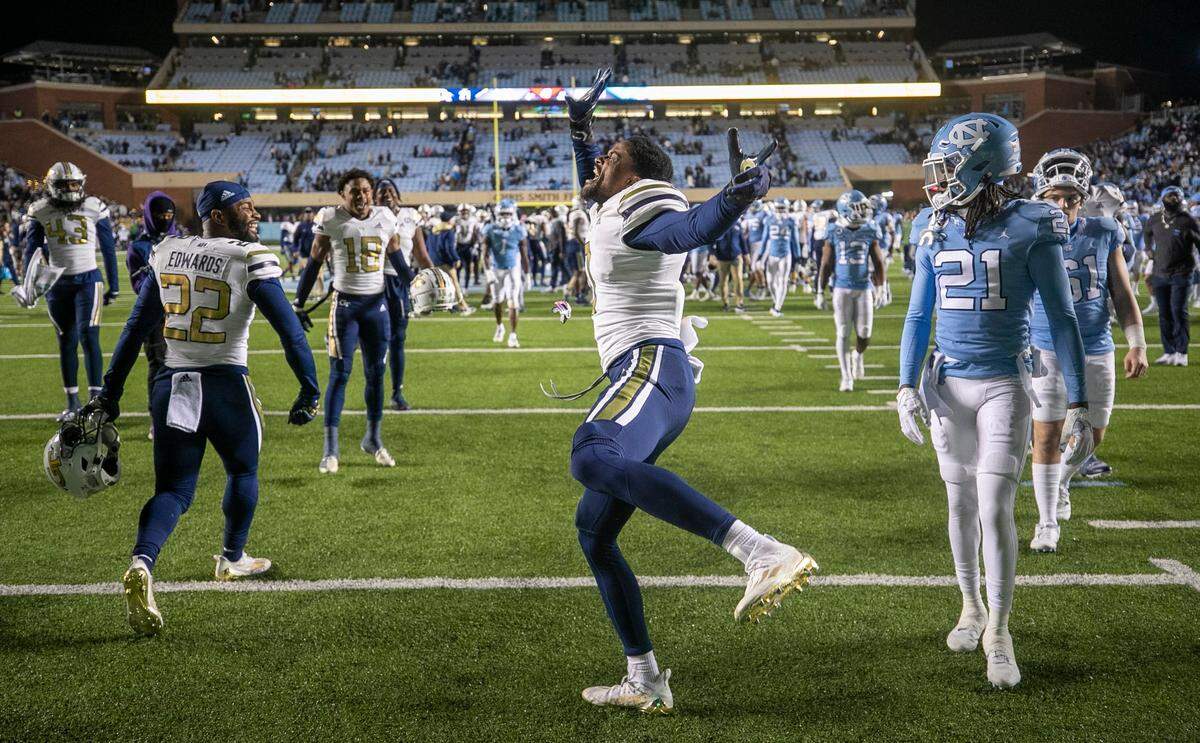 Georgia Tech’s Myles Sims (0) celebrates the Yellowjackets’ 21-17 victory over North Carolina on Saturday, November 19, 2022 at Kenan Stadium in Chapel Hill, N.C.