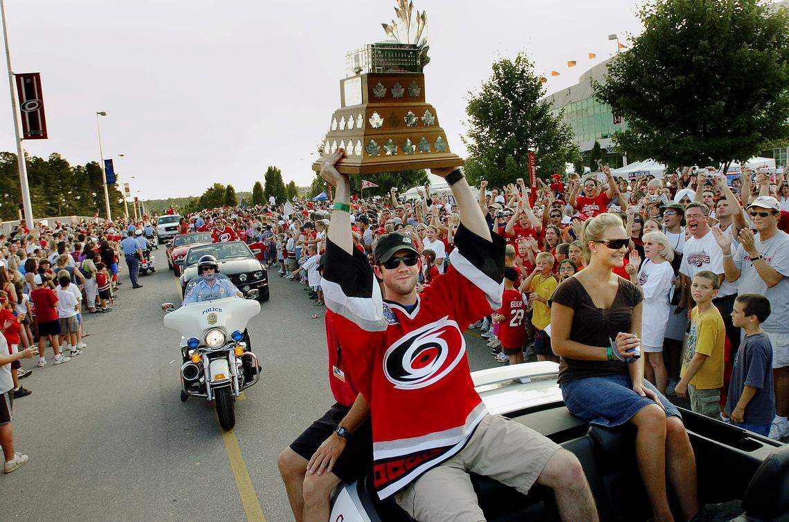 Carolina Hurricanes goalie Cam Ward shows off his Conn Smythe trophy as MVP June 20, 2006, during a parade and celebration in honor of the 2006 Stanley Cup Champions at the RBC Center parking lot.