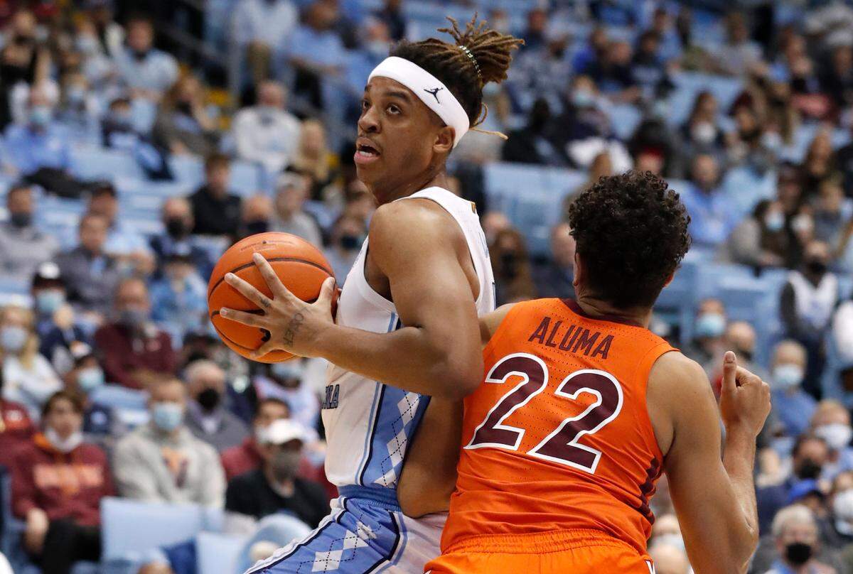 North Carolina’s Armando Bacot (5) works against Virginia Tech’s Keve Aluma (22) during the first half of UNC’s game against Virginia Tech at the Smith Center in Chapel Hill, N.C., Monday, Jan. 24, 2022.