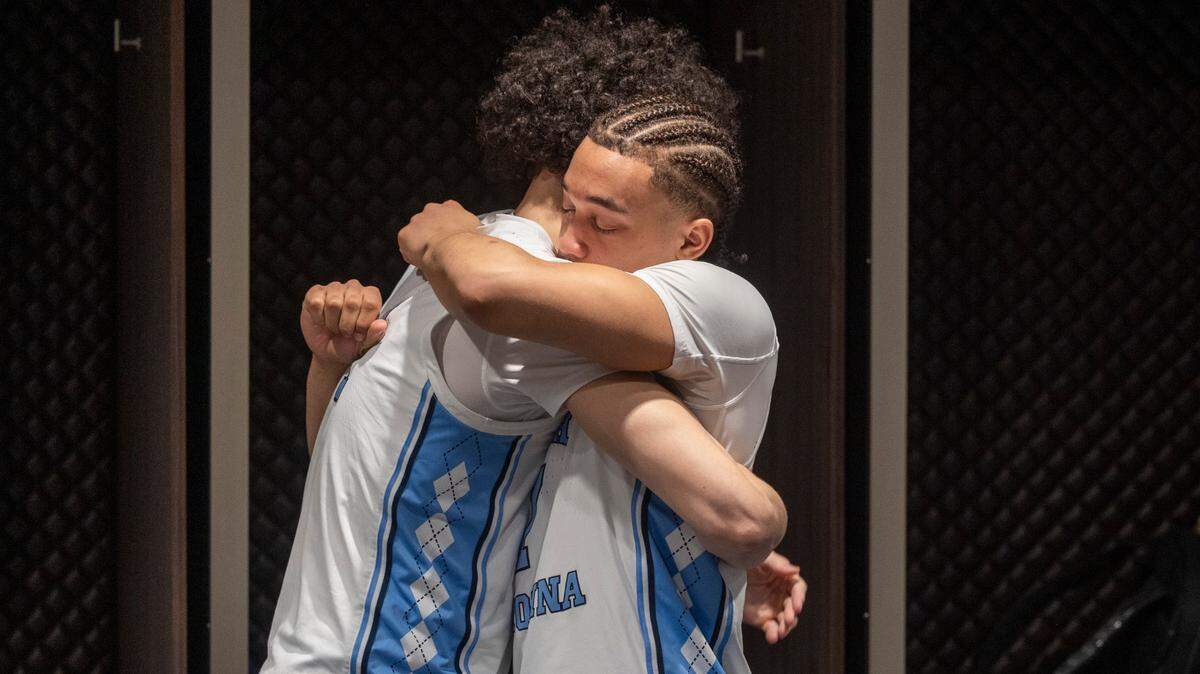 North Carolina’s Seth Trimble (7) embraces teammate Zayden High (1) inside the Tar Heels’ locker room following their 89-87 loss to Alabama in the West Regional Sweet Sixteen on Thursday, March 28, 2024 at Crypto.com Arena in Los Angeles, CA.
