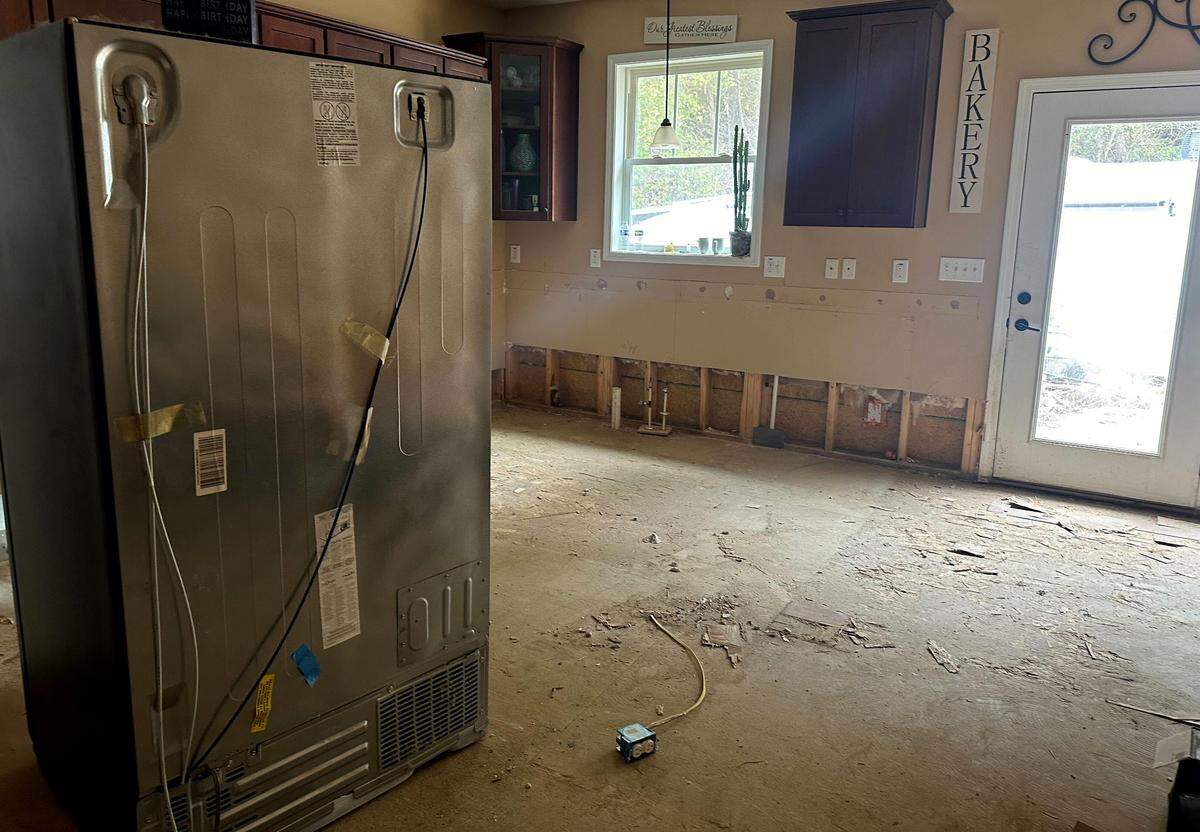 Paul Laws is working on tearing out the damage done by the remnants of Hurricane Helene, which flooded the home he built from scratch in 2016, taking furniture and treasured belongings with it.
