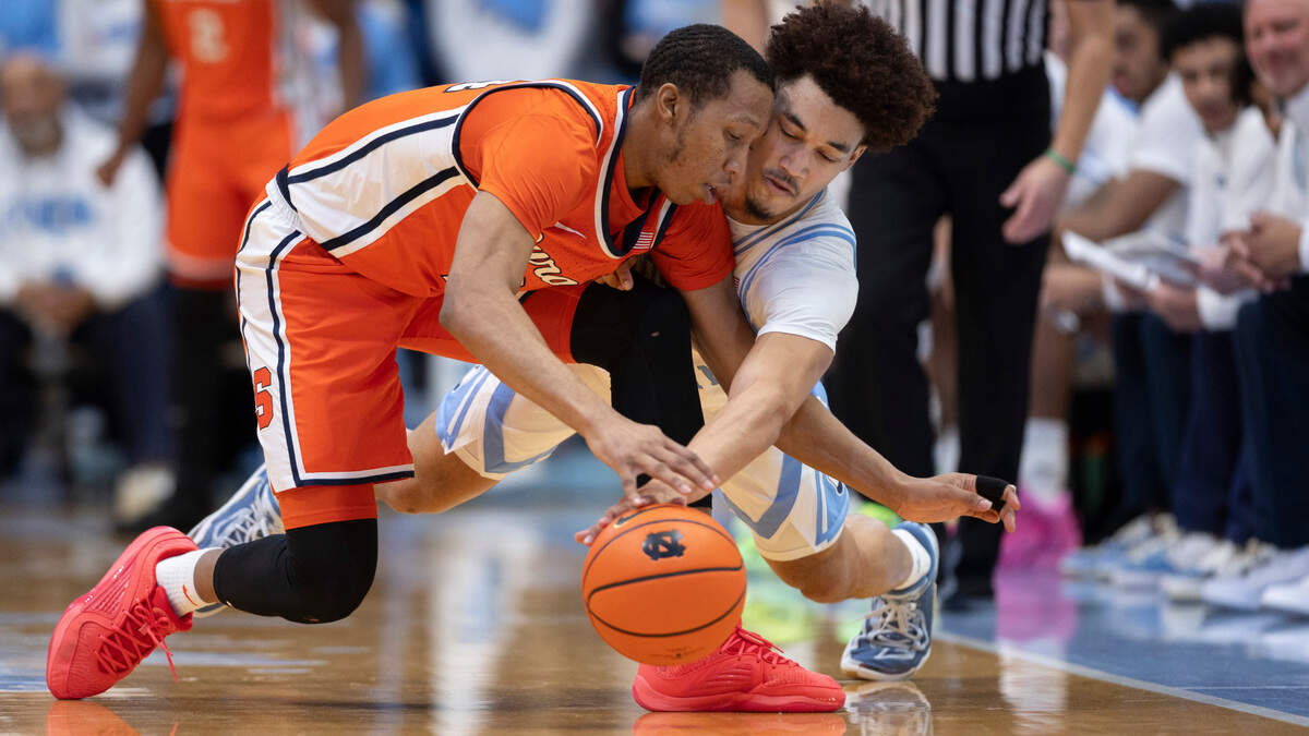 North Carolina’s Seth Trimble (7) makes a steal from Syracuse’s Quadir Copeland (24) in the first half on Saturday, January 13, 204 at the Smith Center in Chapel Hill, N.C.