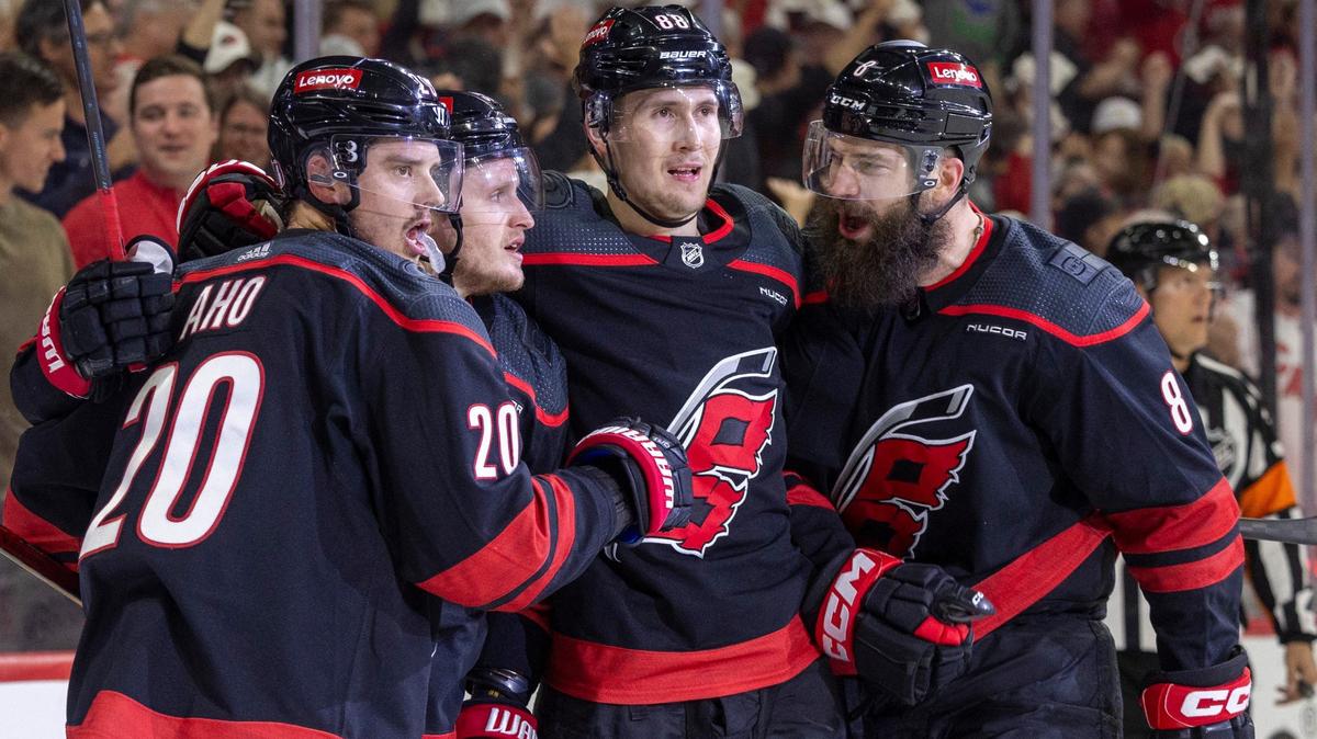 Carolina Hurricanes center Sebastian Aho (20) celebrates with teammates Jake Guentzel (59), Martin Necas (88) and Brent Burns (8) after scoring in the first period on New York Rangers goaltender Igor Shesterkin (31) during Game 4 in the second round of the 2024 Stanley Cup playoffs on Saturday, May 11, 2024 at PNC Arena, in Raleigh N.C.