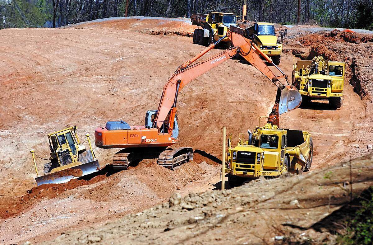 In this file photo from 2008, heavy machinery moves earth for construction of the Google data center site in Lenoir.