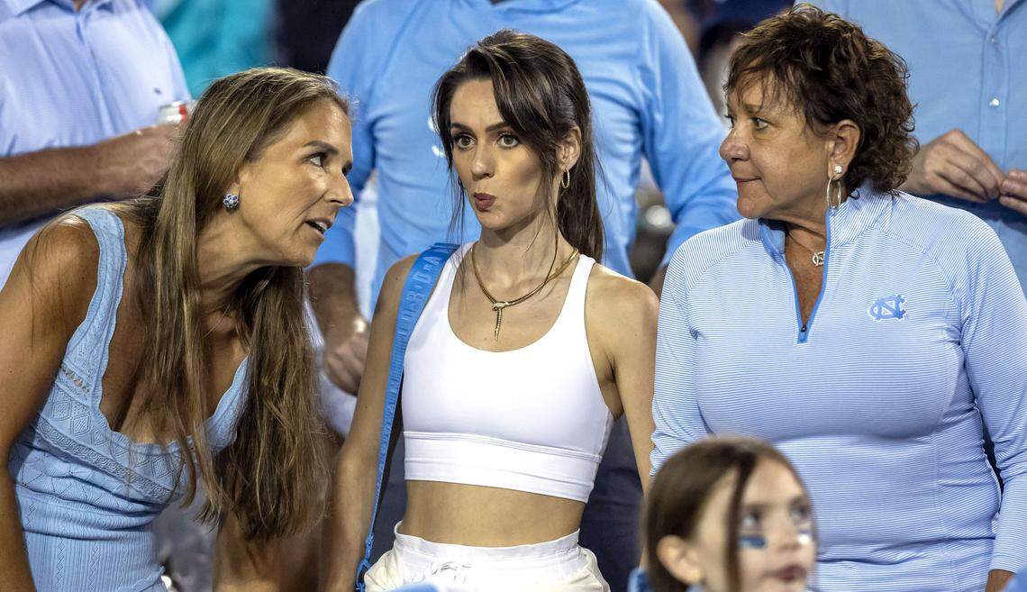 Jordon Hudson watches the Tar Heels’ game against UNC Charlotte on Saturday, September 6, 2025 with UNC Trustee Jennifer Lloyd, left, and Millie Lombardi, wife of general manager Michael Lombardi, at Jerry Richardson Stadium in Charlotte, N.C. 