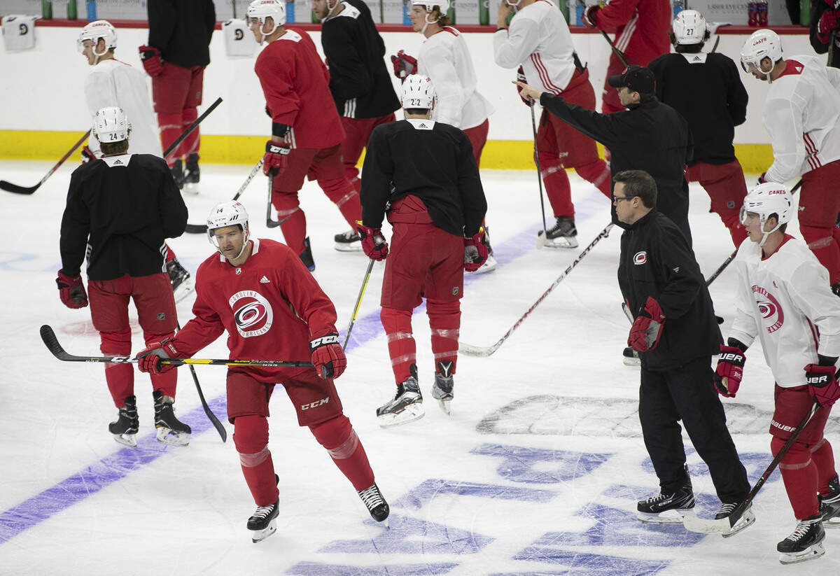 Carolina Hurricanes’ Justin Williams (14) skates away from a team huddle as head coach Rod Brind’Amour directs players during practice on Tuesday, April 9, 2019 at PNC Arena in Raleigh, N.C.