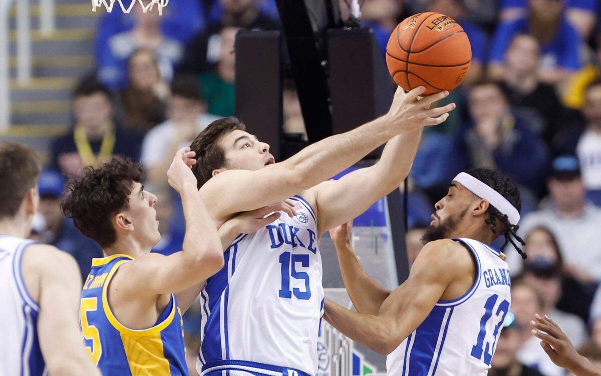Duke’s Ryan Young (15) works on pulling in a rebound form Pittsburgh’s Guillermo Diaz Graham (25) during the first half of Duke’s game against Pitt in the quarterfinals of the ACC Men’s Basketball Tournament in Greensboro, N.C., Thursday, March 9, 2023.