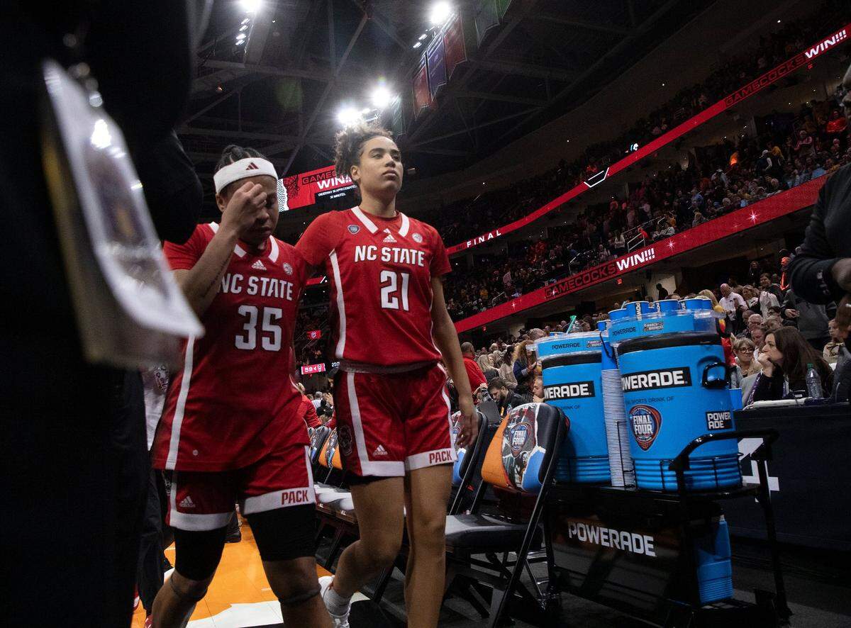 N.C. State’s Zoe Brooks and Madison Hayes walk off the court following the Wolfpack’s 78-59 Final Four loss to South Carolina at Rocket Mortgage FieldHouse on Friday, April 5, 2024, in Cleveland, Ohio.