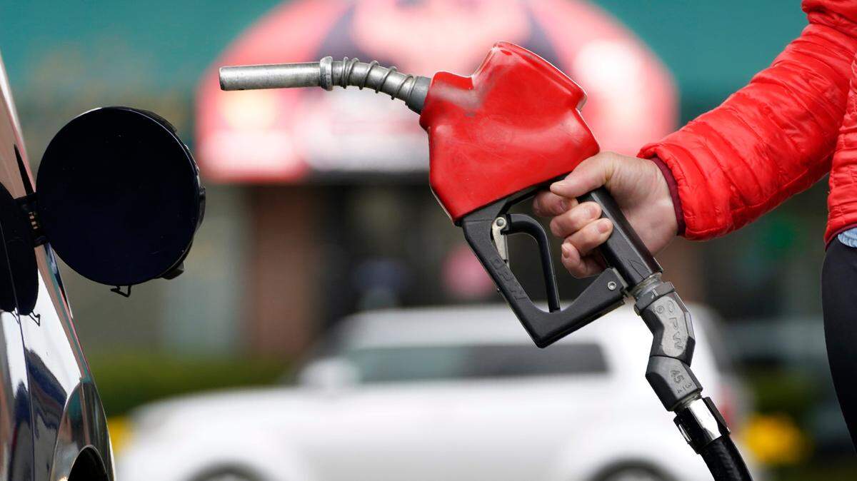 A motorist prepares to pump gas Thursday, April 22, 2021, in Portland, Maine. (AP Photo/Robert F. Bukaty)