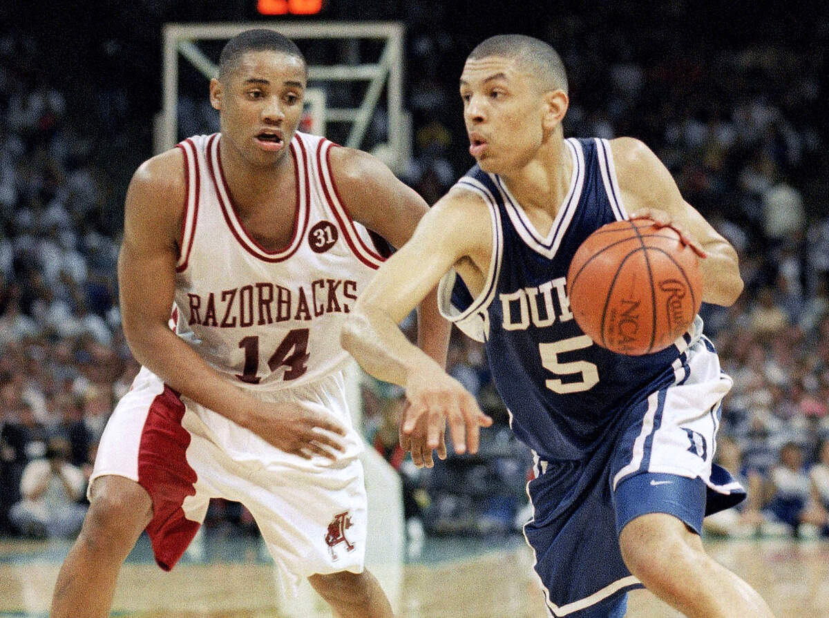 Duke’s Jeff Capel (5) drives past Arkansas’ Corey Beck (14) during their NCAA Championship game, Monday, April 4, 1994, Charlotte, N.C.