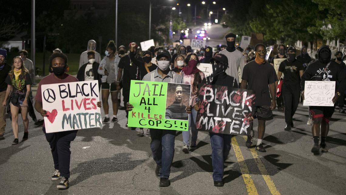 Protesters march along E. Main Street in Durham, N.C. on Monday night June 1, 2020, during an evening of peaceful protest that spanned most of downtown, honoring the life of George Floyd.