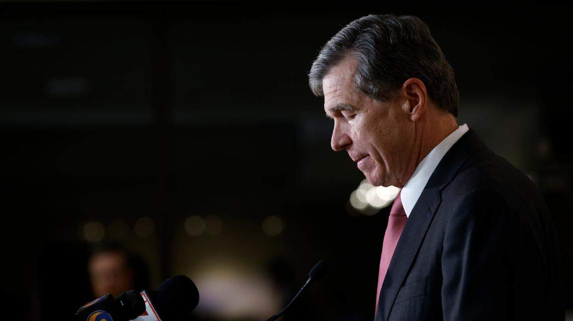 North Carolina Gov. Roy Cooper speaks at a press briefing following a shooting that left five dead, including an off-duty police officer, on Thursday, Oct. 13, 2022, in Raleigh, N.C.