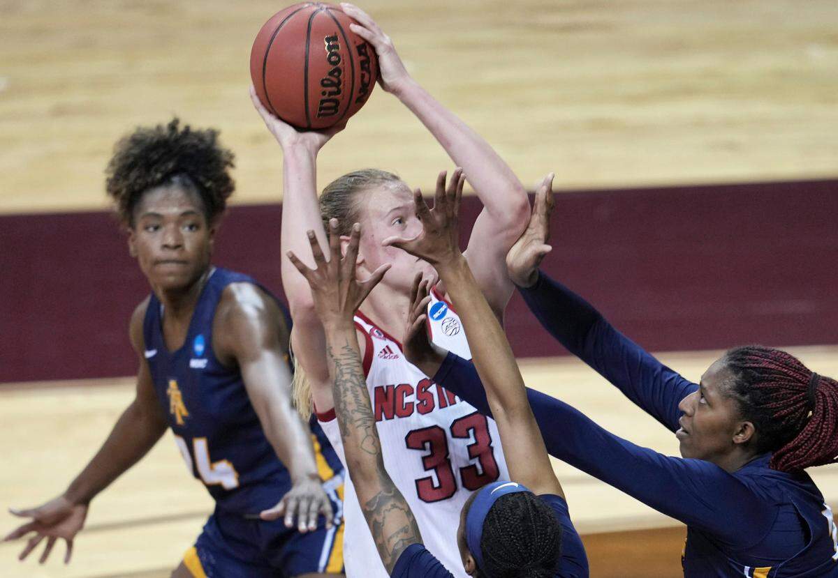 North Carolina State’s Elissa Cunane (33) tries to shoot against North Carolina A&T players during the first half of a college basketball game in the first round of the women’s NCAA tournament at the University Events Center in San Marcos, Texas, Sunday, March 21, 2021. 