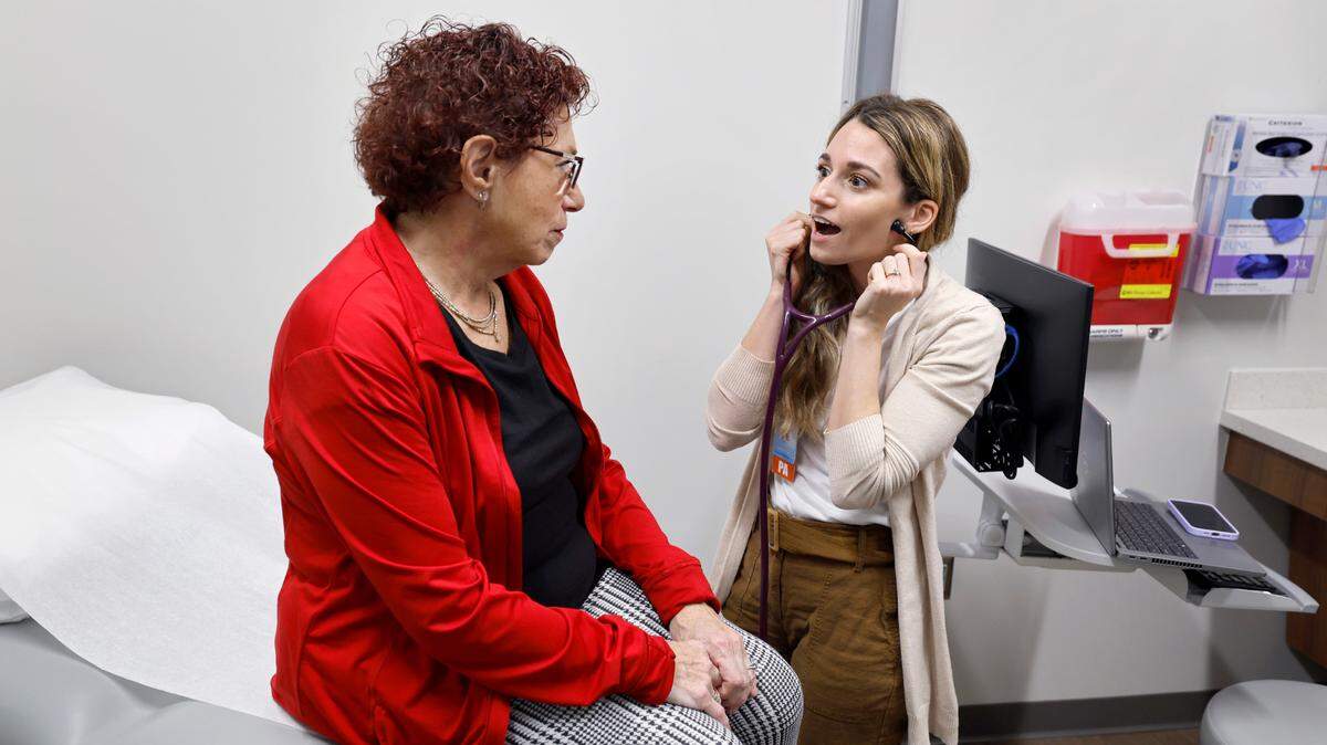 Physician assistant Sarah Garwood talks with Meryl Ruda during an appointment at the UNC Family Medicine at Panther Creek office Wednesday, Nov. 8, 2023.