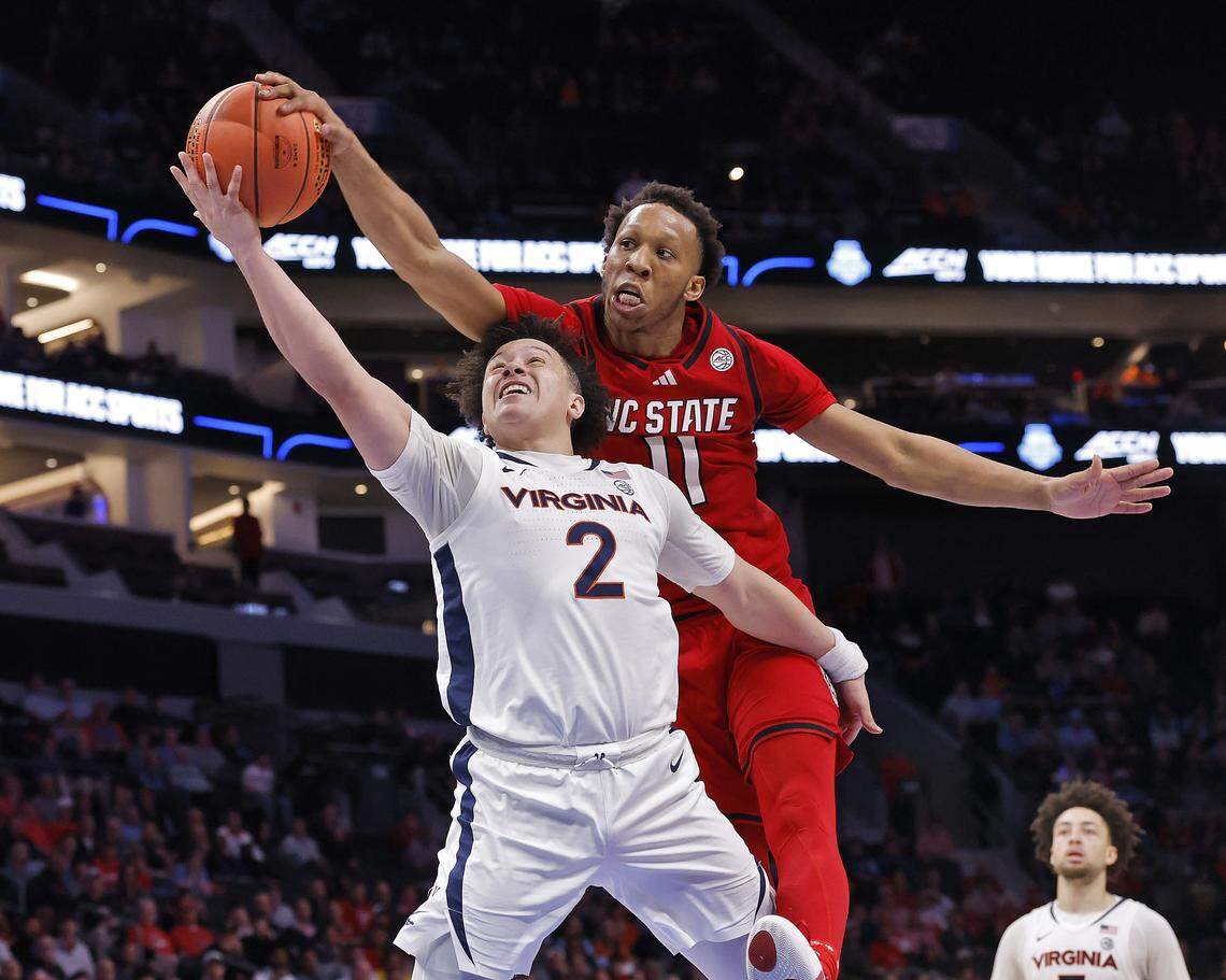 N.C. State's Quadir Copeland blocks a shot by Virginia's Chance Mallory during the second half of the Wolfpack’s 81-74 loss in the ACC Tournament quarterfinals on Thursday, March 12, 2026, at the Spectrum Center in Charlotte, N.C. 