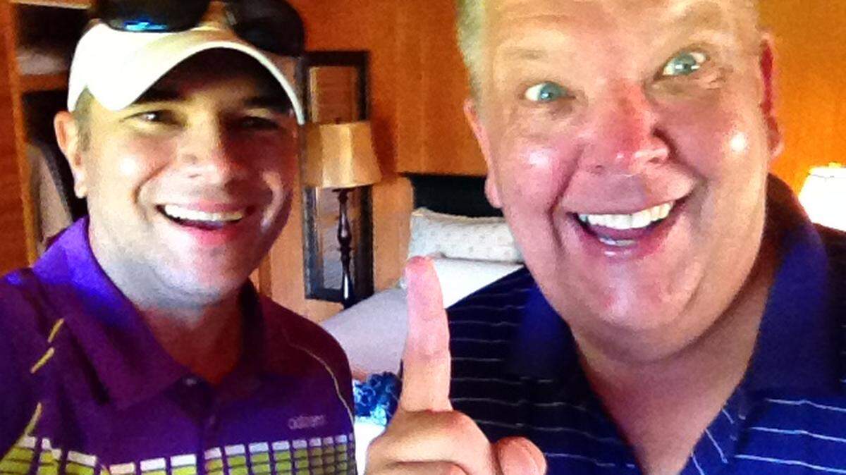Busta Howard, right, who died last week at age 60, with N&O sports columnist Luke DeCock in August 2014.