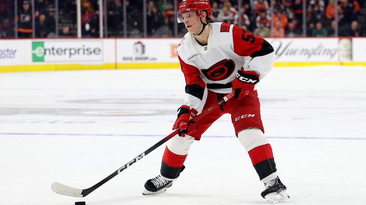 Jackson Blake of the Carolina Hurricanes skates with the puck before scoring during a shootout against the Philadelphia Flyers at Xfinity Mobile Arena on Dec. 13, 2025 in Philadelphia, Pennsylvania. On Monday, Blake scored in overtime to lift the Hurricanes to a win over the New York Rangers.