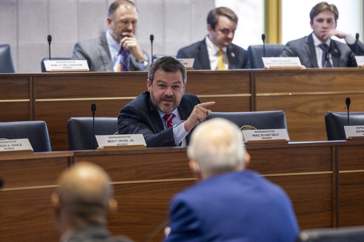 Rep. Mike Schietzelt, a Wake County Republican, center, questions Chapel Hill-Carrboro City Schools Superintendent Rodney Trice and School Board Chair George Griffin during a sometimes tense N.C. House committee hearing on Wednesday, Dec. 10, 2025, in the Legislative Building auditorium in Raleigh. Griffin apologized to the committee Wednesday for not being clearer about his comments on the Parents’ Bill of Rights amid a barrage of questions and accusations about “woke” learning in the classroom.