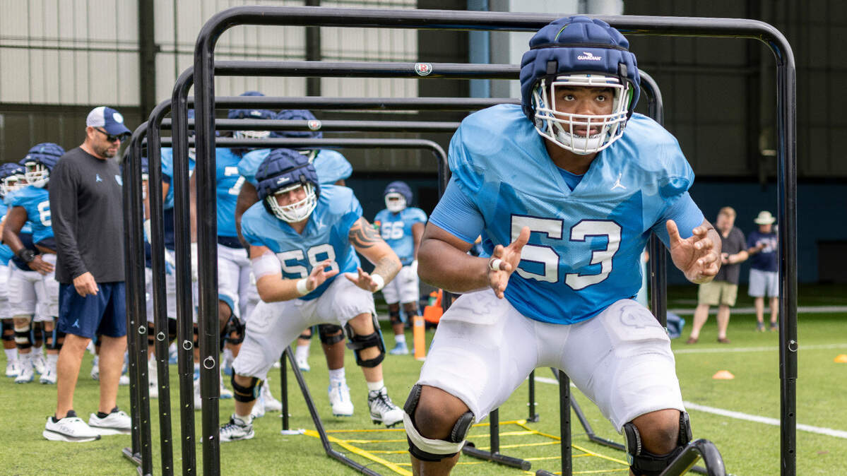 North Carolina senior offensive lineman Willie Limpkin (53) works through a drill during the Tar Heels’ practice on Tuesday, August 6, 2024 in Chapel Hill, N.C.