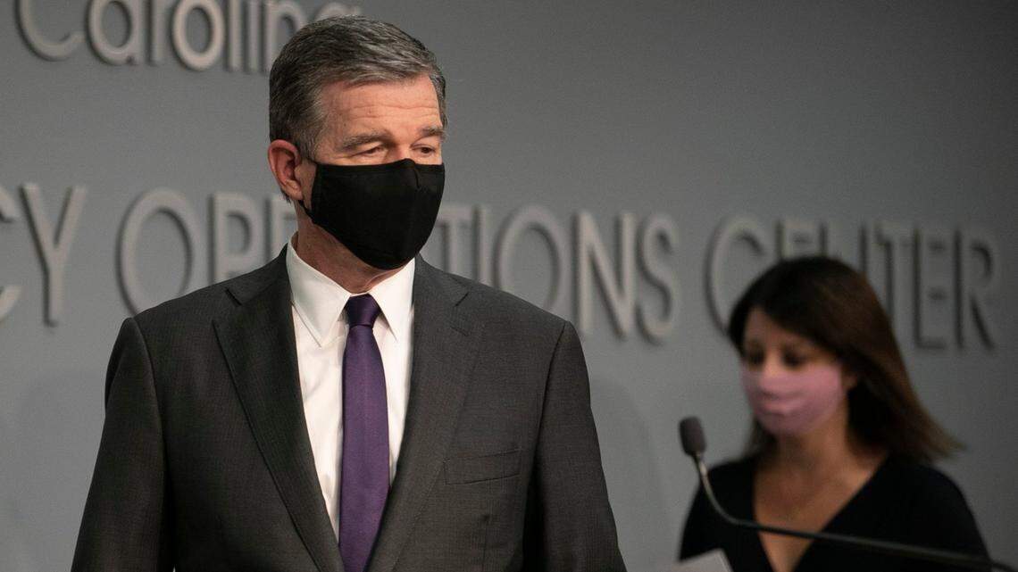 North Carolina Governor Roy Cooper and Dr. Mandy Cohen, Secretary of the North Carolina Department of Health and Human Services arrive for a press briefing on the COVID-19 virus at the Emergency Operations Center on Thursday, August 13, 2020 in Raleigh, N.C.