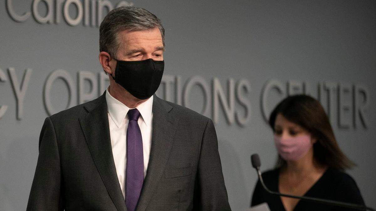North Carolina Governor Roy Cooper and Dr. Mandy Cohen, Secretary of the North Carolina Department of Health and Human Services arrive for a press briefing on the COVID-19 virus at the Emergency Operations Center on Thursday, August 13, 2020 in Raleigh, N.C.
