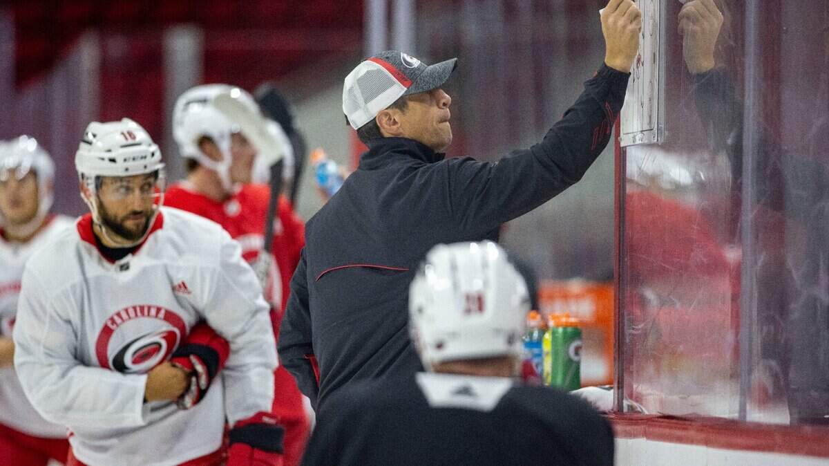Carolina Hurricanes coach Rod Brind’Amour works with his team during the opening day of training camp on Thursday, September 23, 2021 at PNC Arena in Raleigh, N.C.