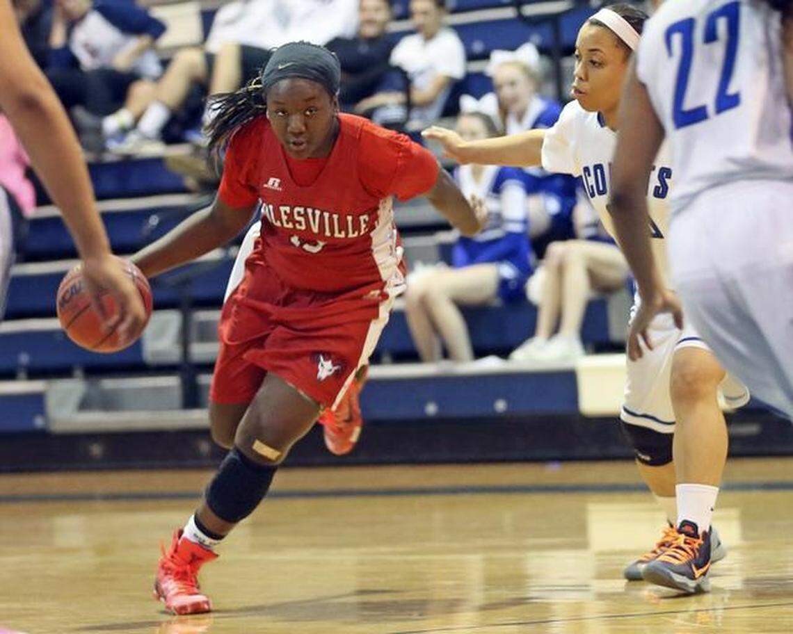 Rolesville High’s Jaylin Powell (13) heads into the lane as Clayton’s Alexis Teel defends the drive.
