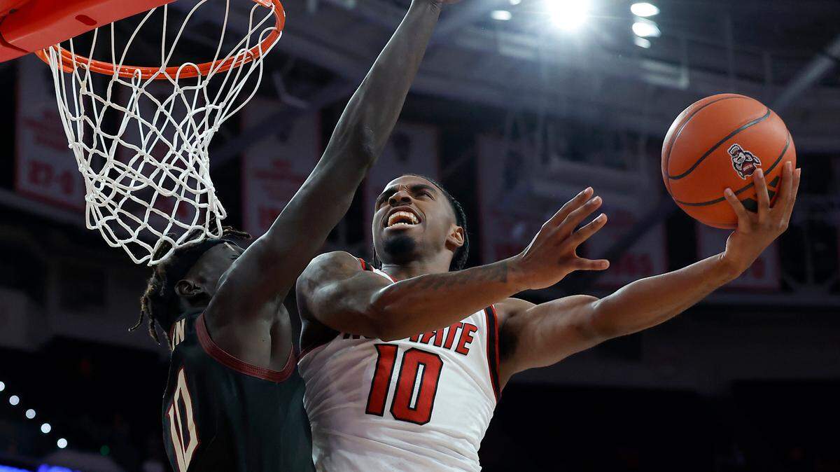 N.C. State’s Marcus Hill drives to the basket against Florida State’s Taylor Bol Bowen during the first half of the Wolfpack’s game on Saturday, Dec. 7, 2024, at Lenovo Center in Raleigh, N.C.