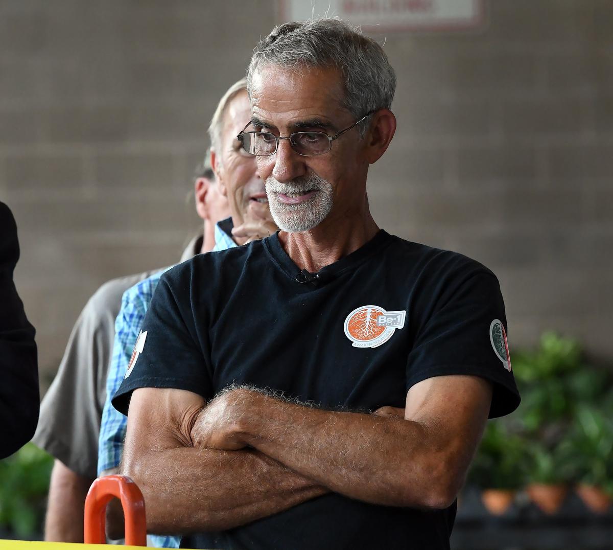 N.C. farmer Danny Vester watches as his  cantaloupe becomes a world record winner weighing in at 65.90 pounds beating the old record of 64.80 pounds at the State Farmer’s Market in Raleigh, N.C. Tuesday, August 14, 2018.The old record of 64.80 pounds was held by an Alaskan farmer.