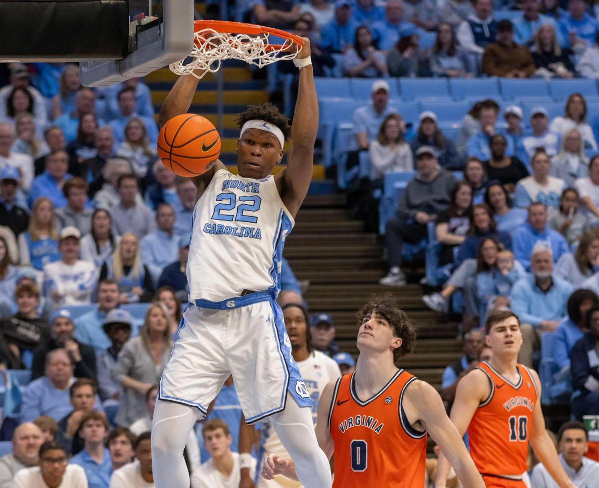 North Carolina forward Ven-Allen Lubin (22) dunks over Virginia forward Blake Buchanan (0) in the second half on Saturday, February 22, 2025 at the Smith Center in 6 victory Chapel Hill, N.C. Lubin scored 14 points in the Tar Heels’ victory.